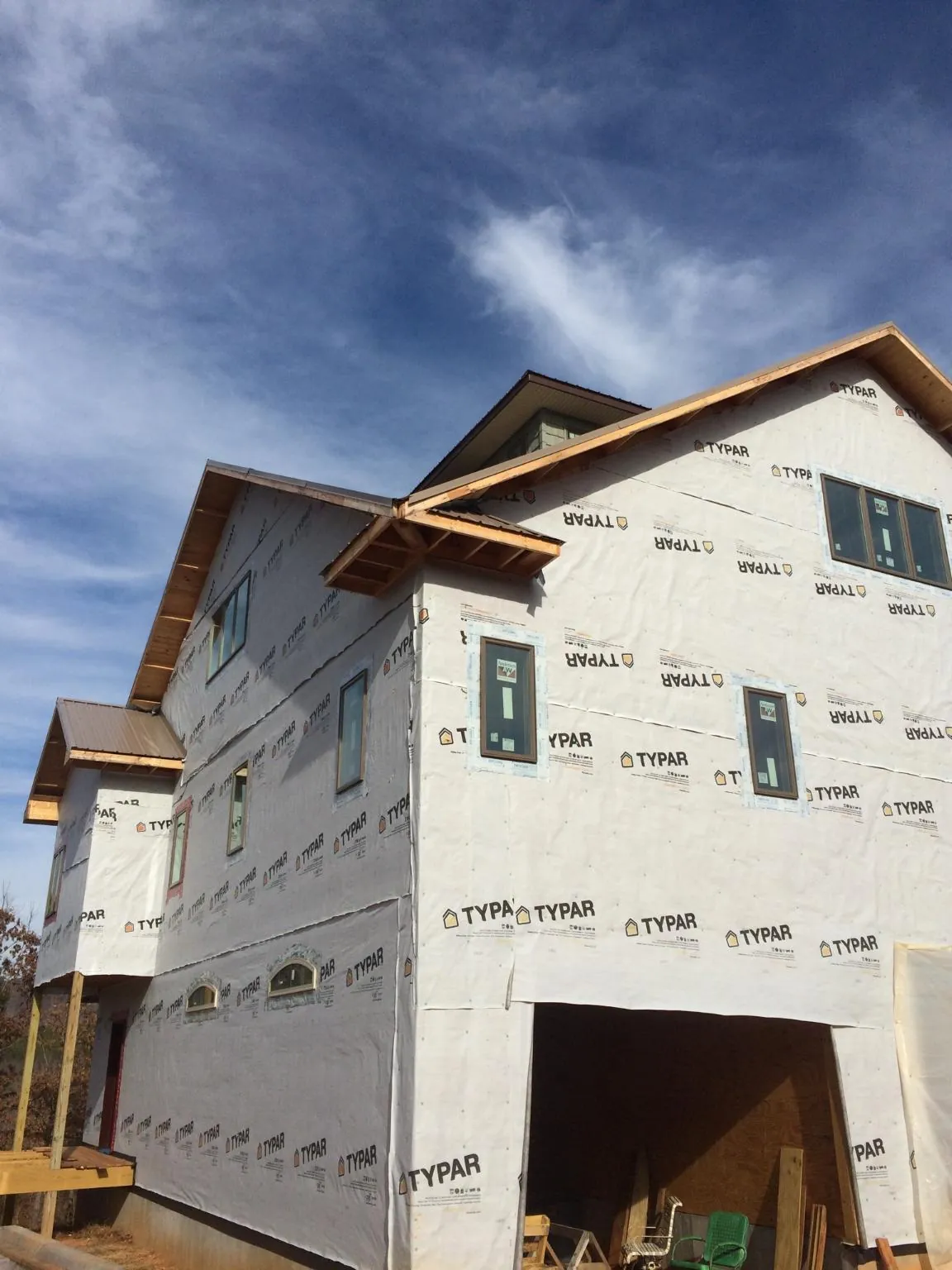 Stick built house wrapped in Typar with new roof framing and dormers in Perkinsville